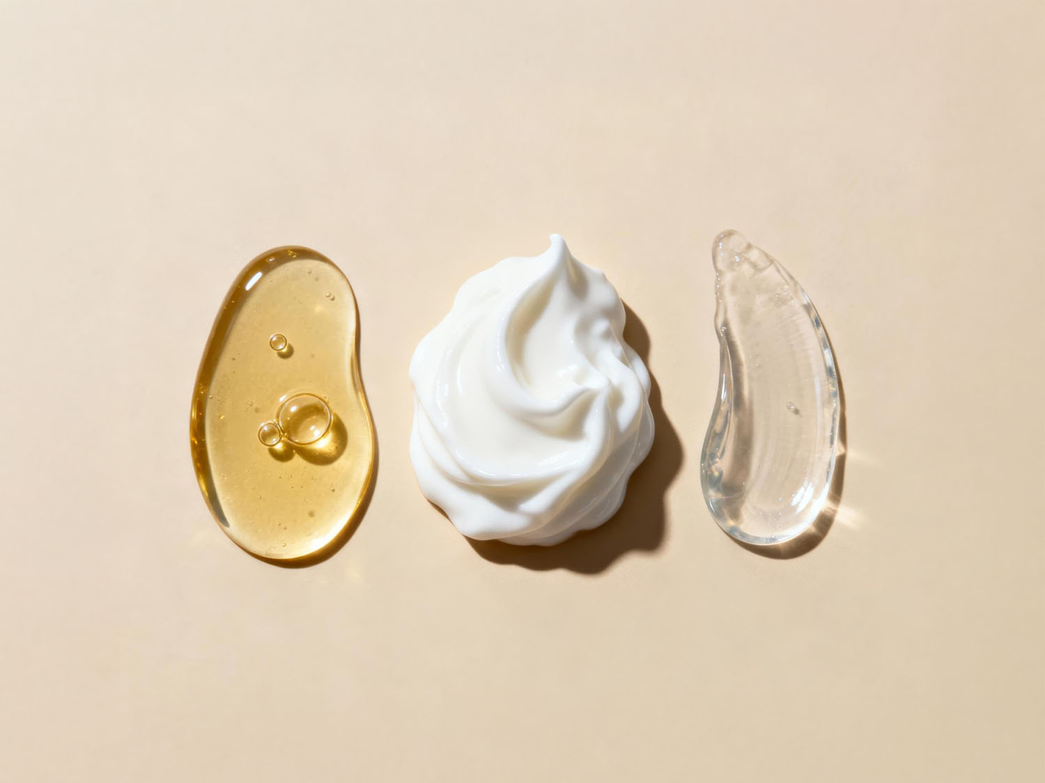 Three skincare product textures representing retinol retinal and tretinoin differences