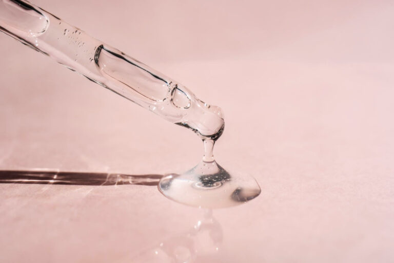 Niacinamide serum falls from the pipette